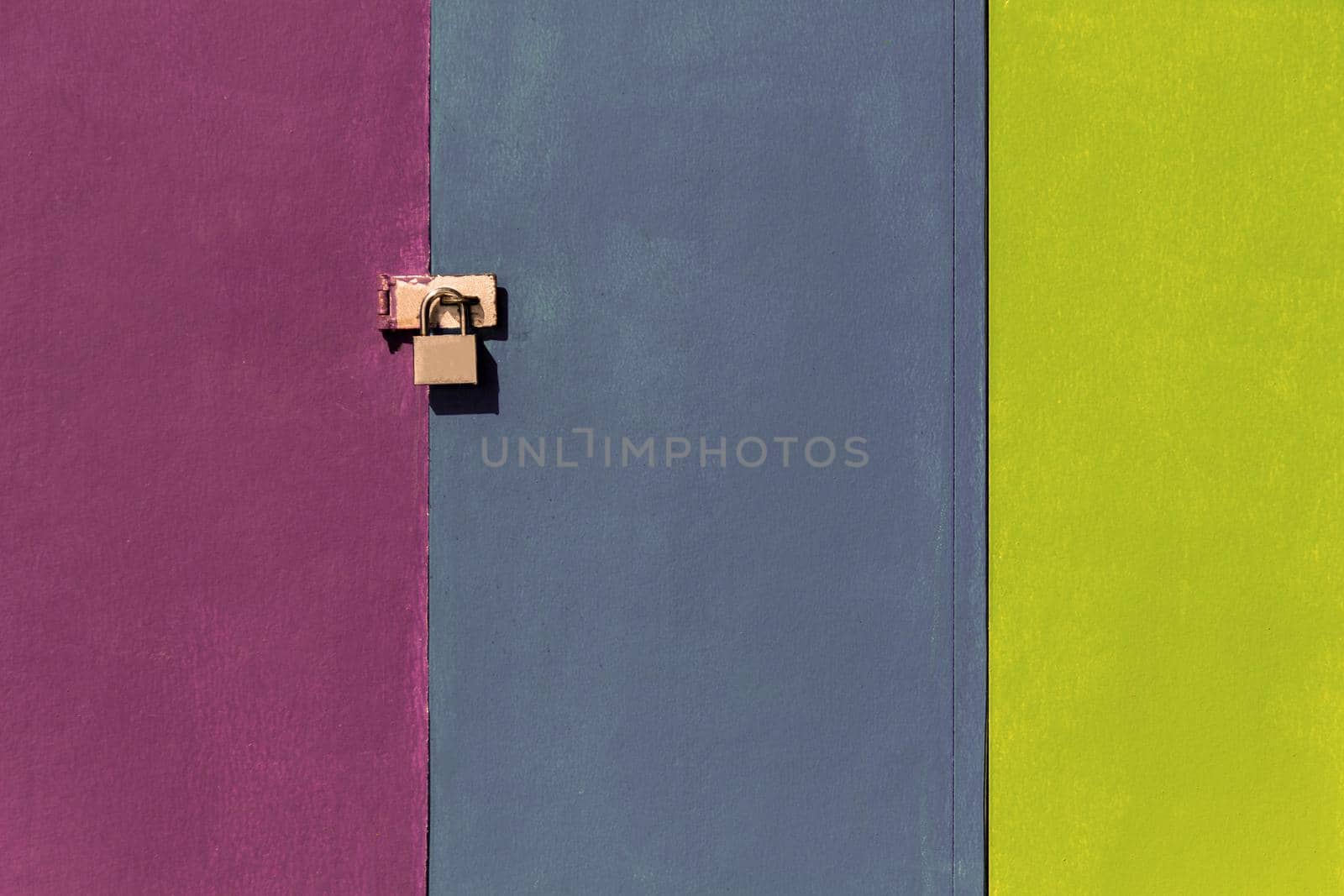 a door lock on a colorful wall, by uveita