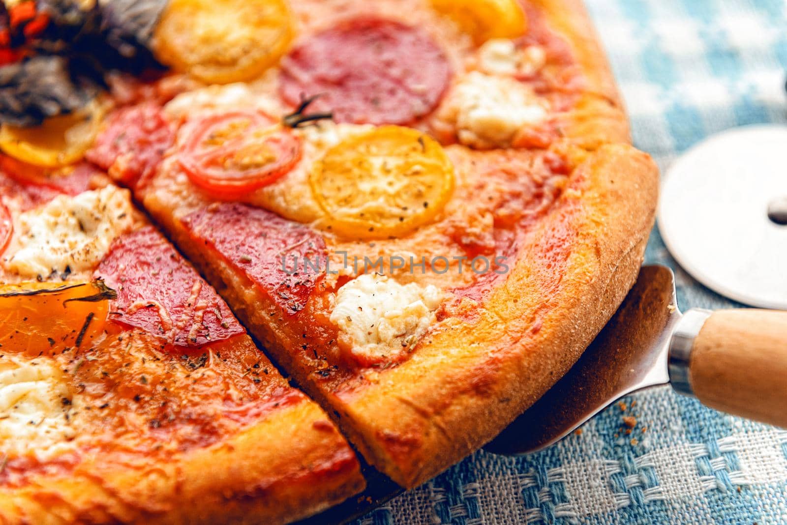 pepperoni italian pizza with salami and cheese on rustic wooden white background