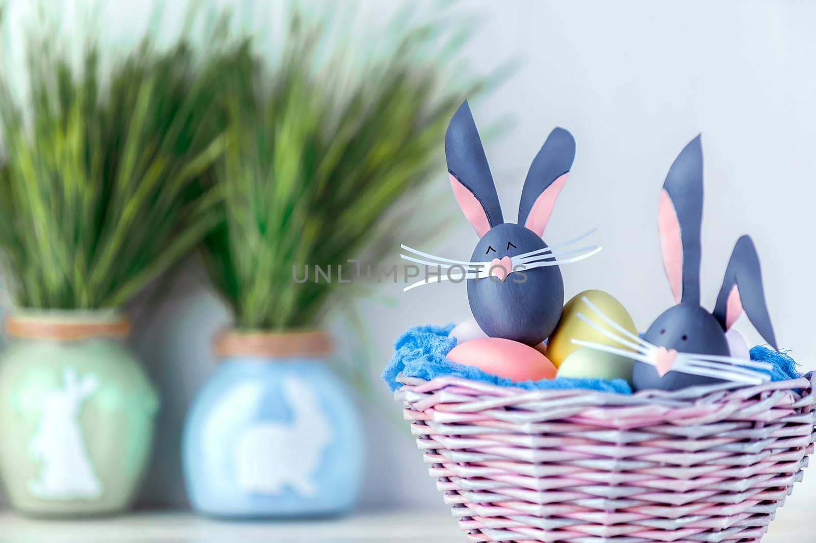 Cute creative photo with easter eggs, some eggs as the Easter Bunny