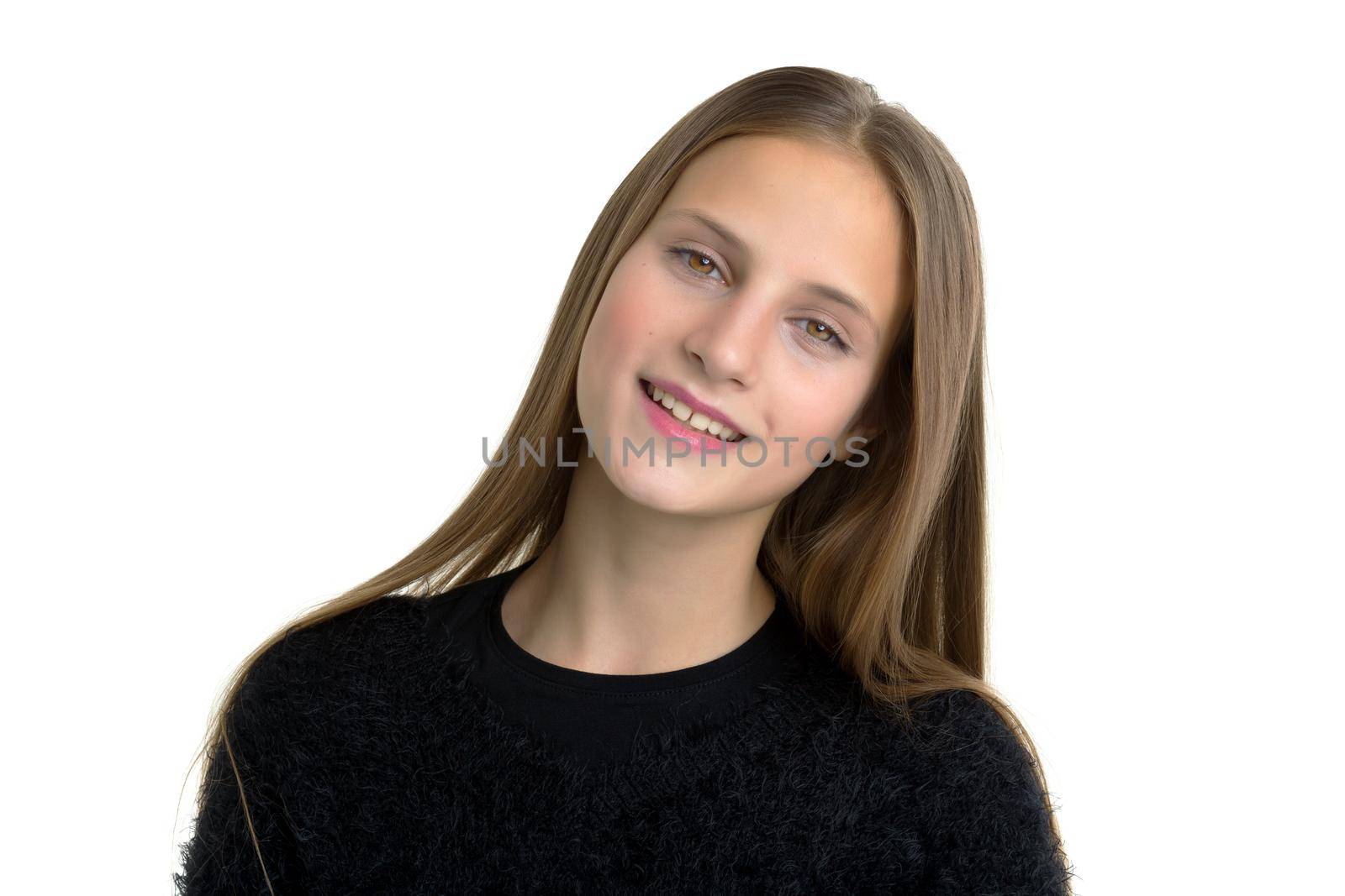 Portrait of beautiful teen girl with long hair. Charming cheerful girl posing on isolated white background in studio. Lovely smiling brown eyed child