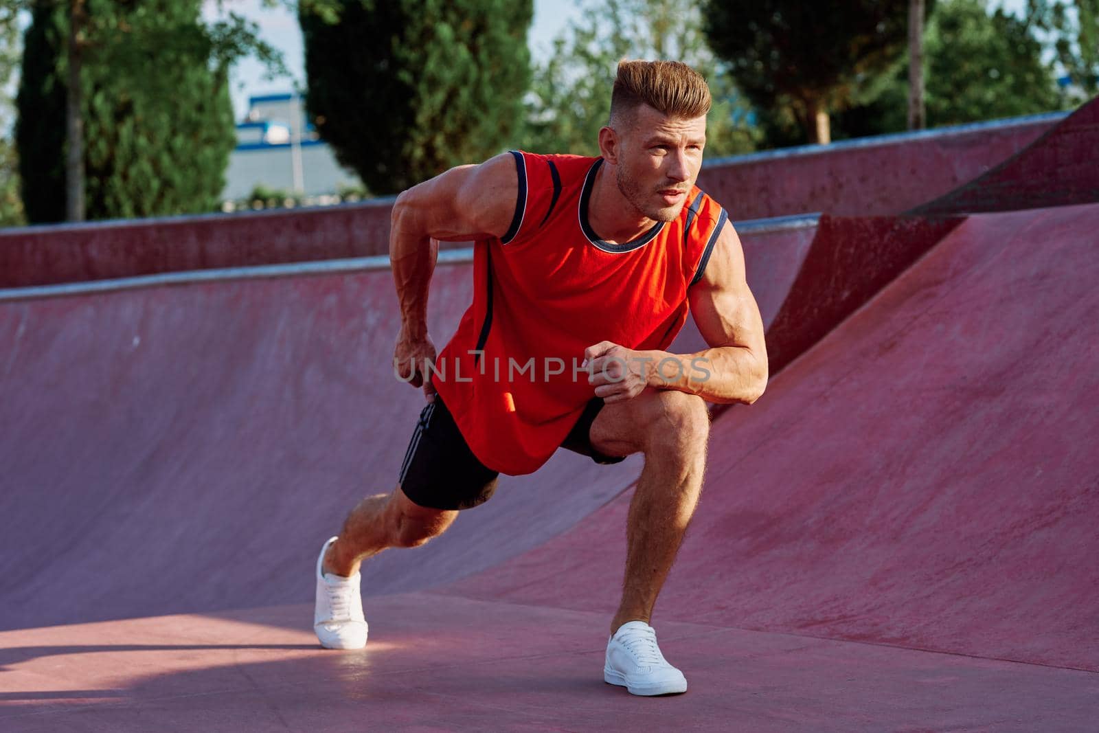 man doing exercises outdoors in the park. High quality photo