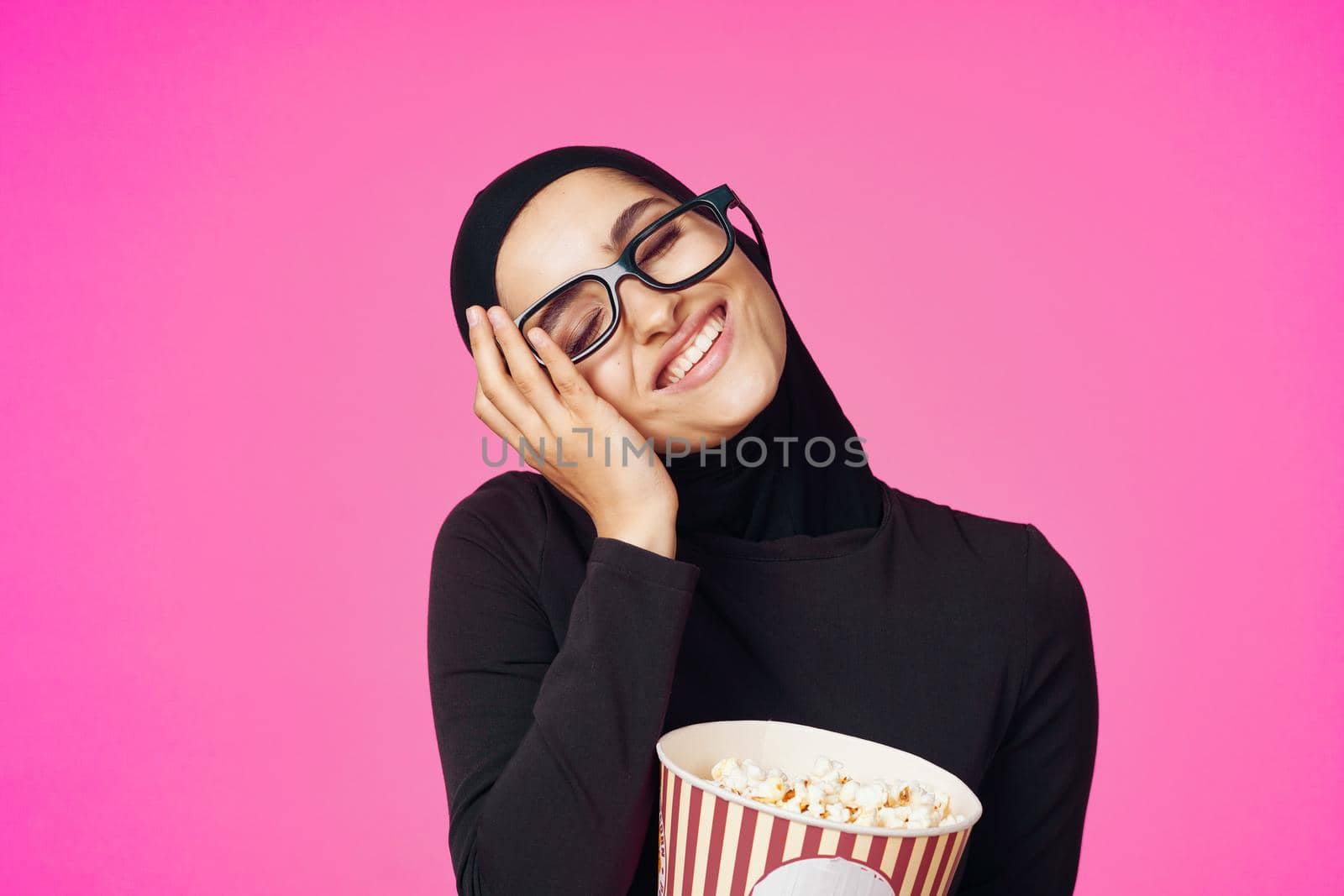 cheerful woman attractive look popcorn glasses movie watching purple background. High quality photo