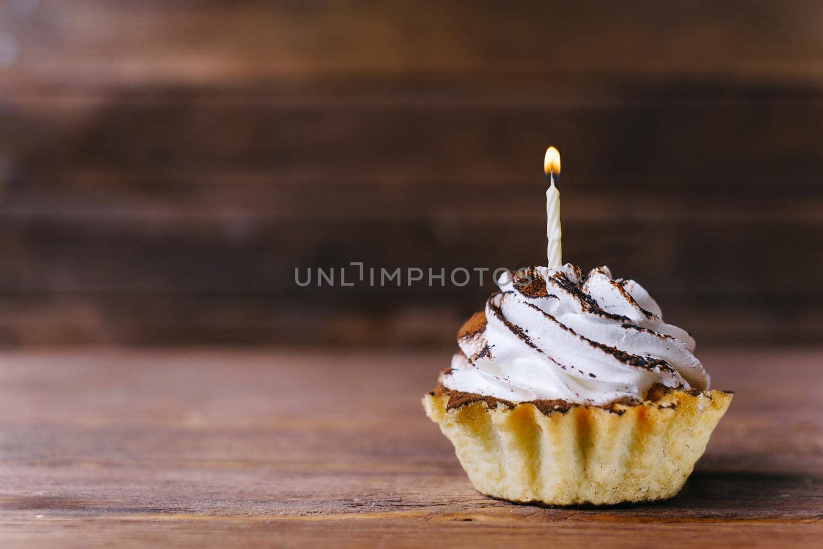 Cream cupcake with candle. by alexAleksei