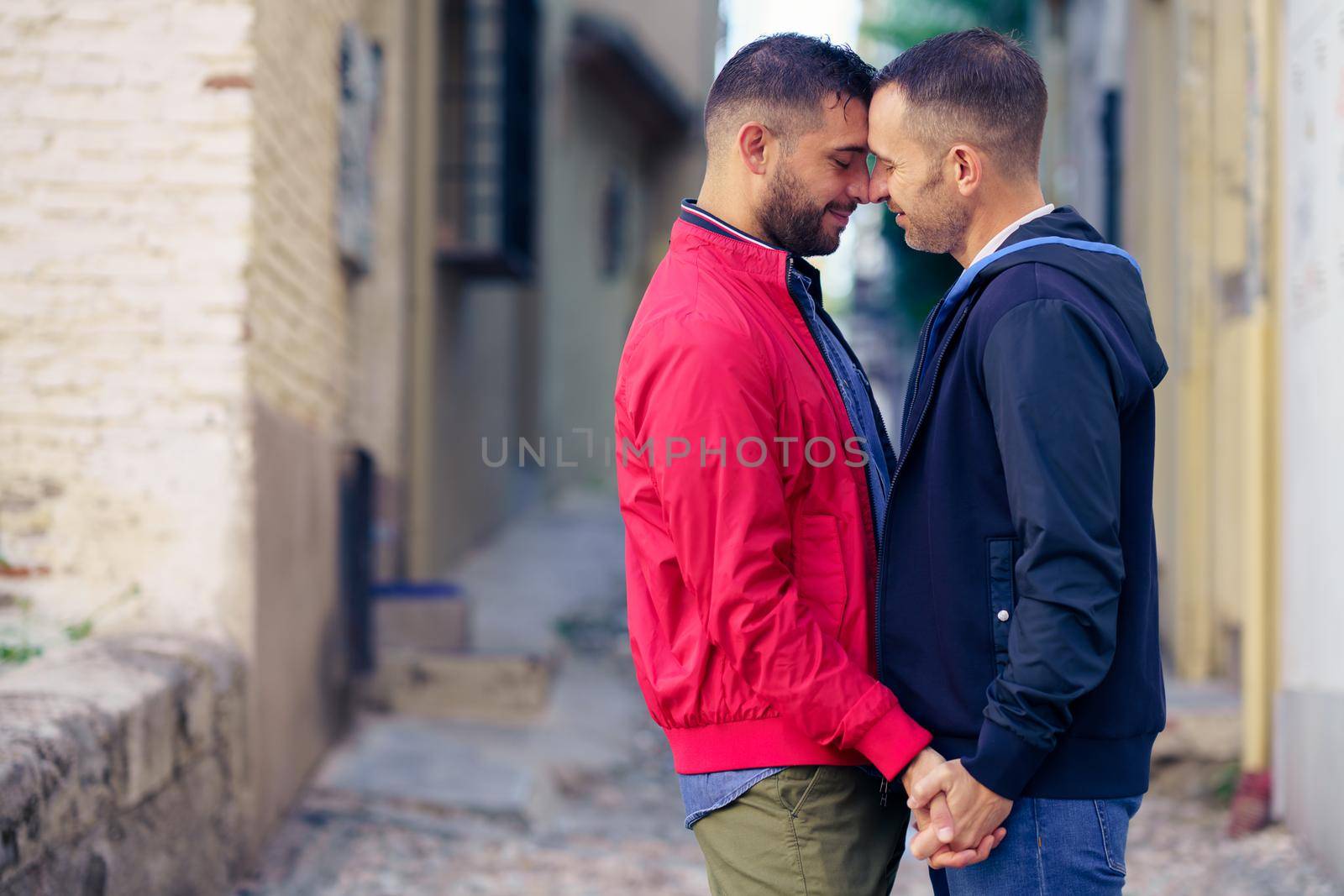 Gay couple in a romantic moment in the street. Lifestyle concept.