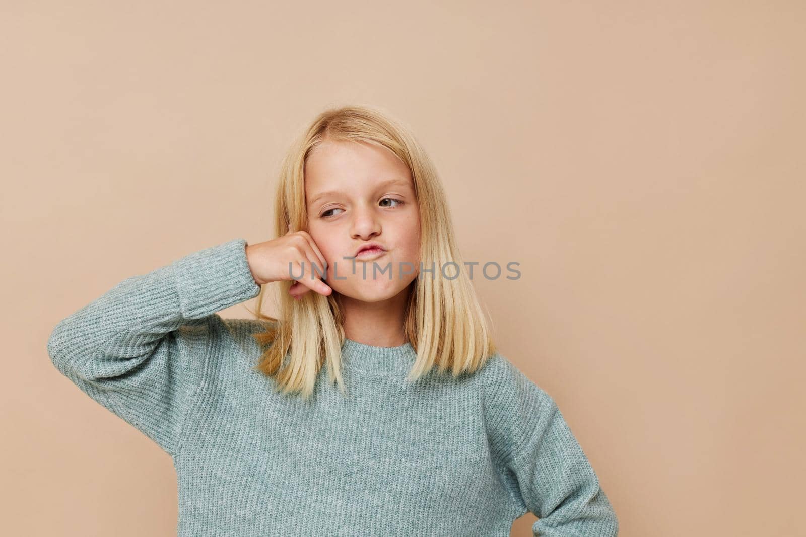 Little cute girl with blond hair cropped view. High quality photo