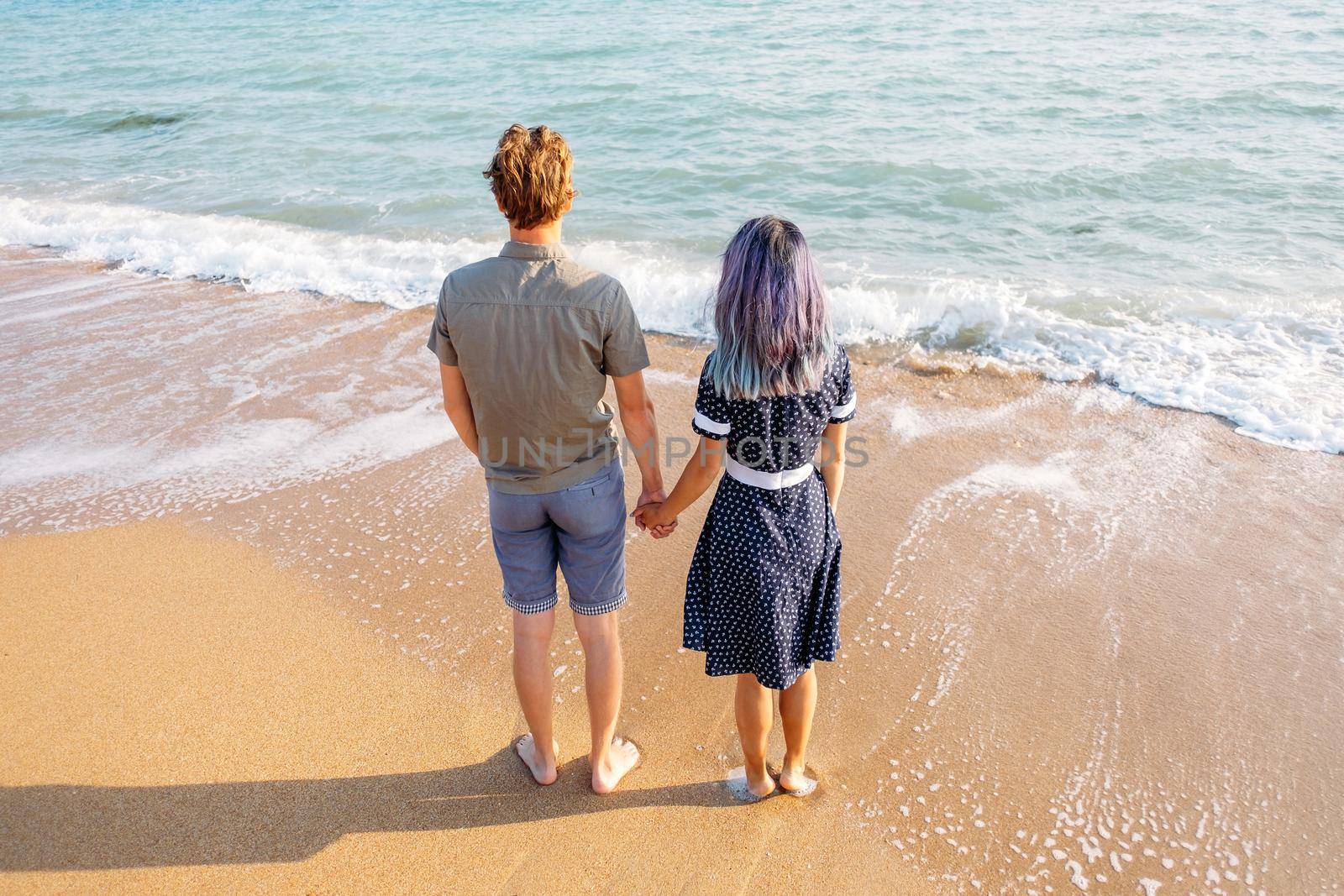 Couple in love enjoying view of sea on vacations. by alexAleksei