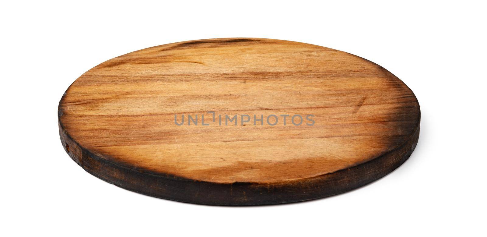 Dark wooden cutting board on white background by Fabrikasimf