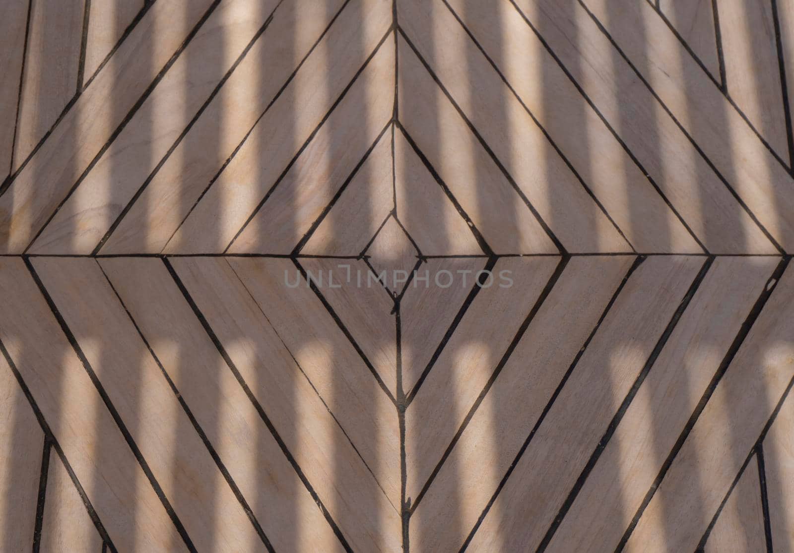 Lights and shadows at wooden floor background, view from the top, pattern and texture.