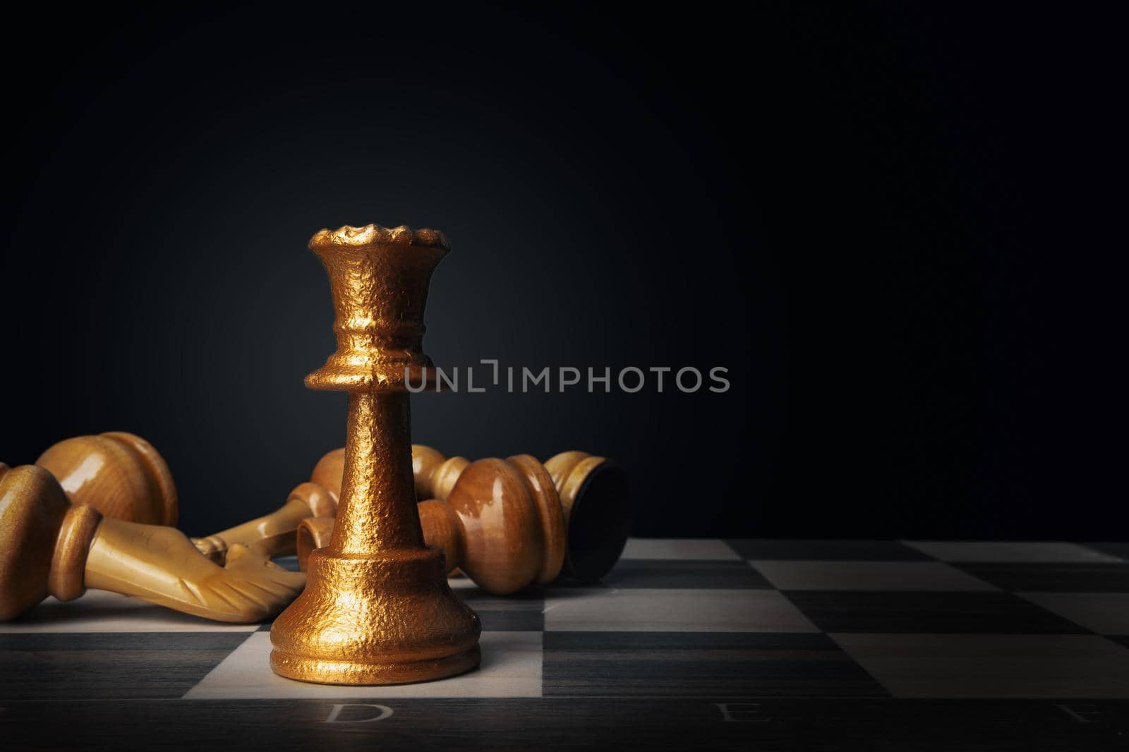 Chess board with figures on dark background close up