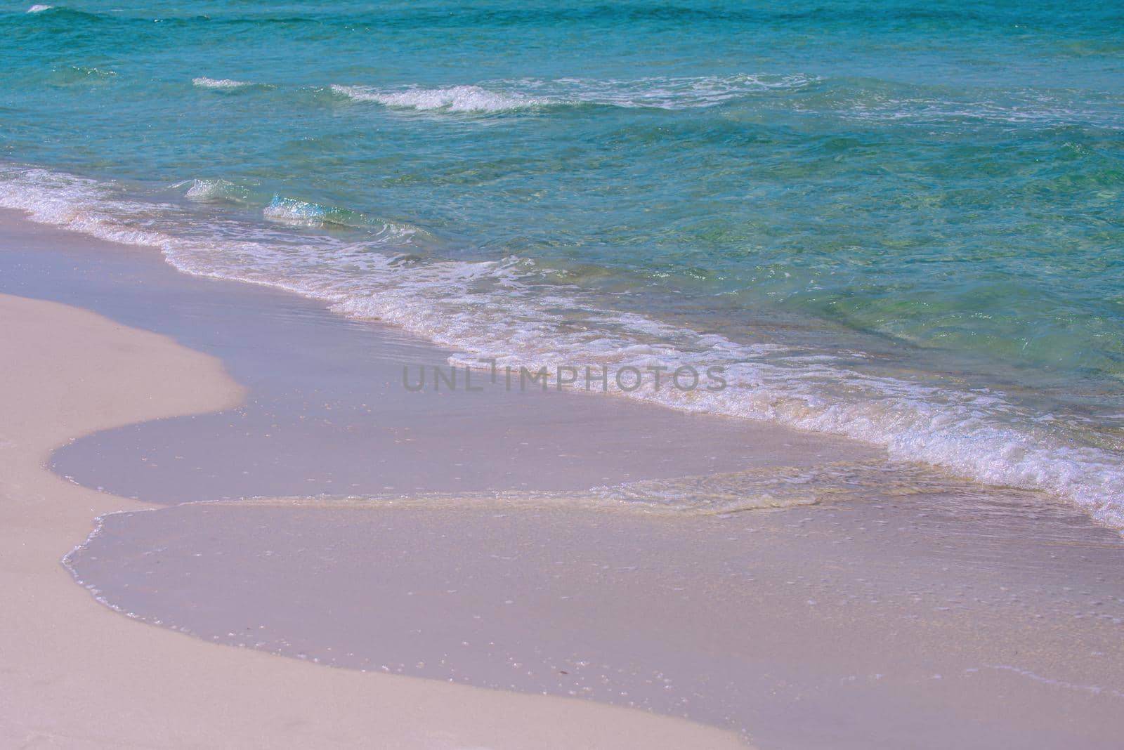 Sand beach with blue ocean and cloudscape background. Ocean blue Background