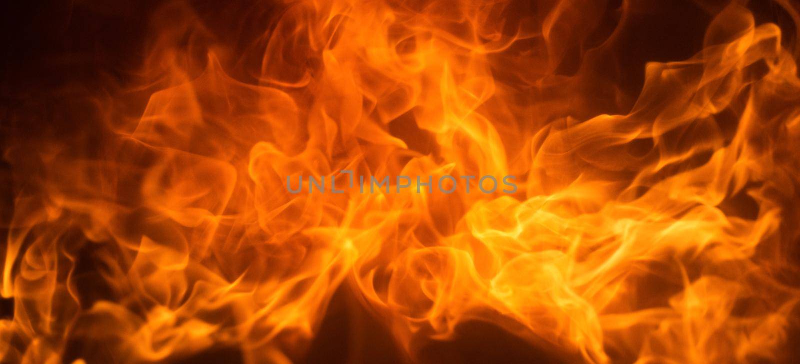 Fire flame texture. Abstract burning blaze flames for banner background. by Tverdokhlib