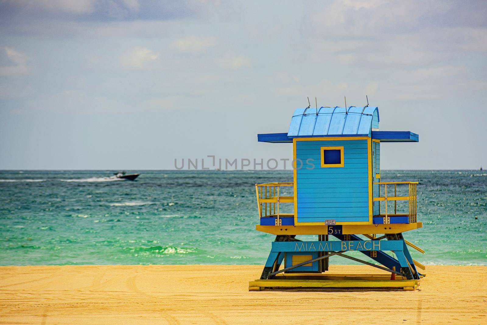 Miami South Beach lifeguard tower and coastline with cloud and blue sky. Miami Beach, Florida. by Tverdokhlib