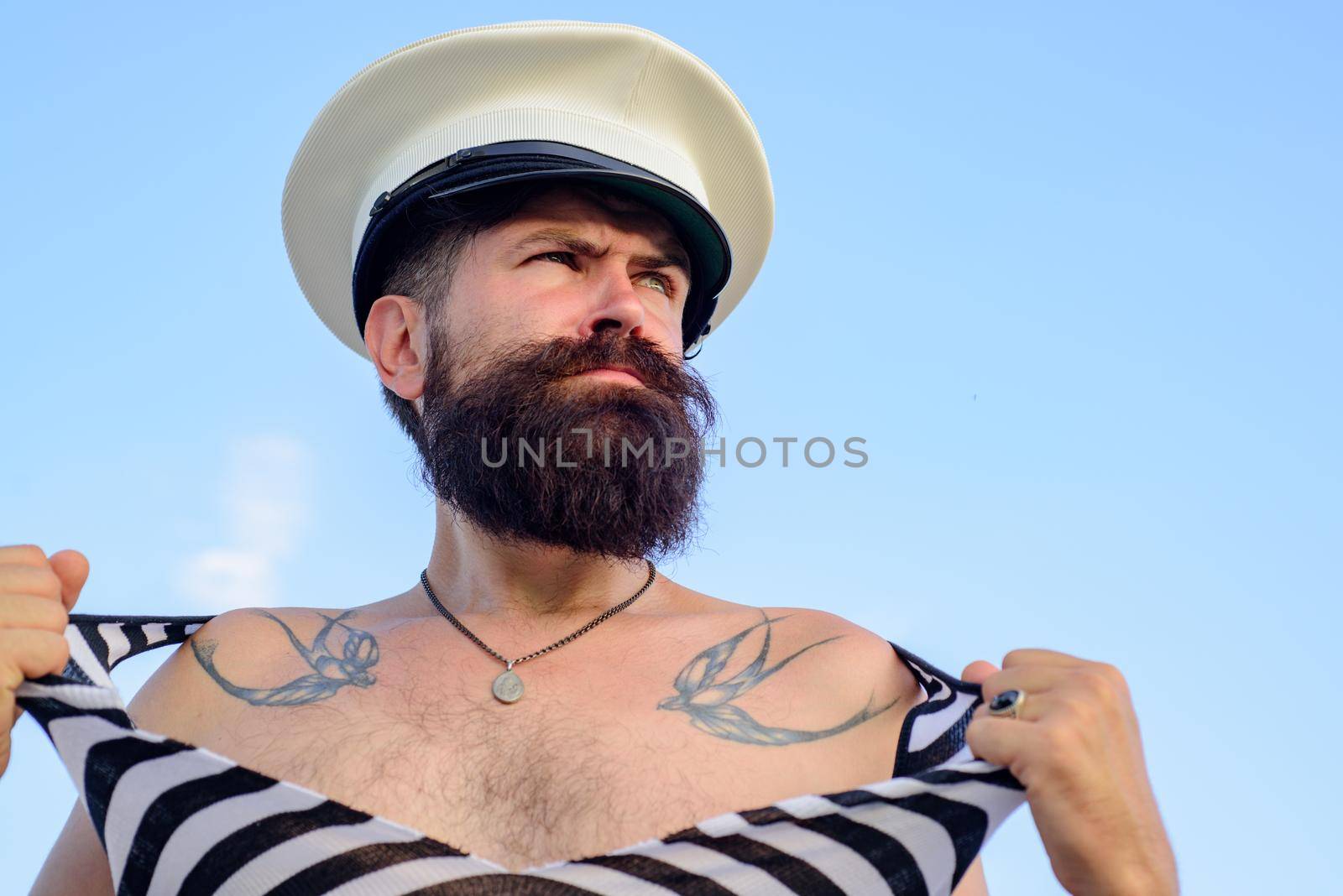 Portrait of serious funny captain. Bearded sailor, seaman or pirate