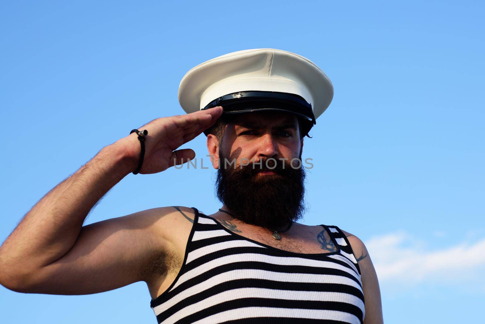 Funny captain sailor wearing hat. Seaman fun
