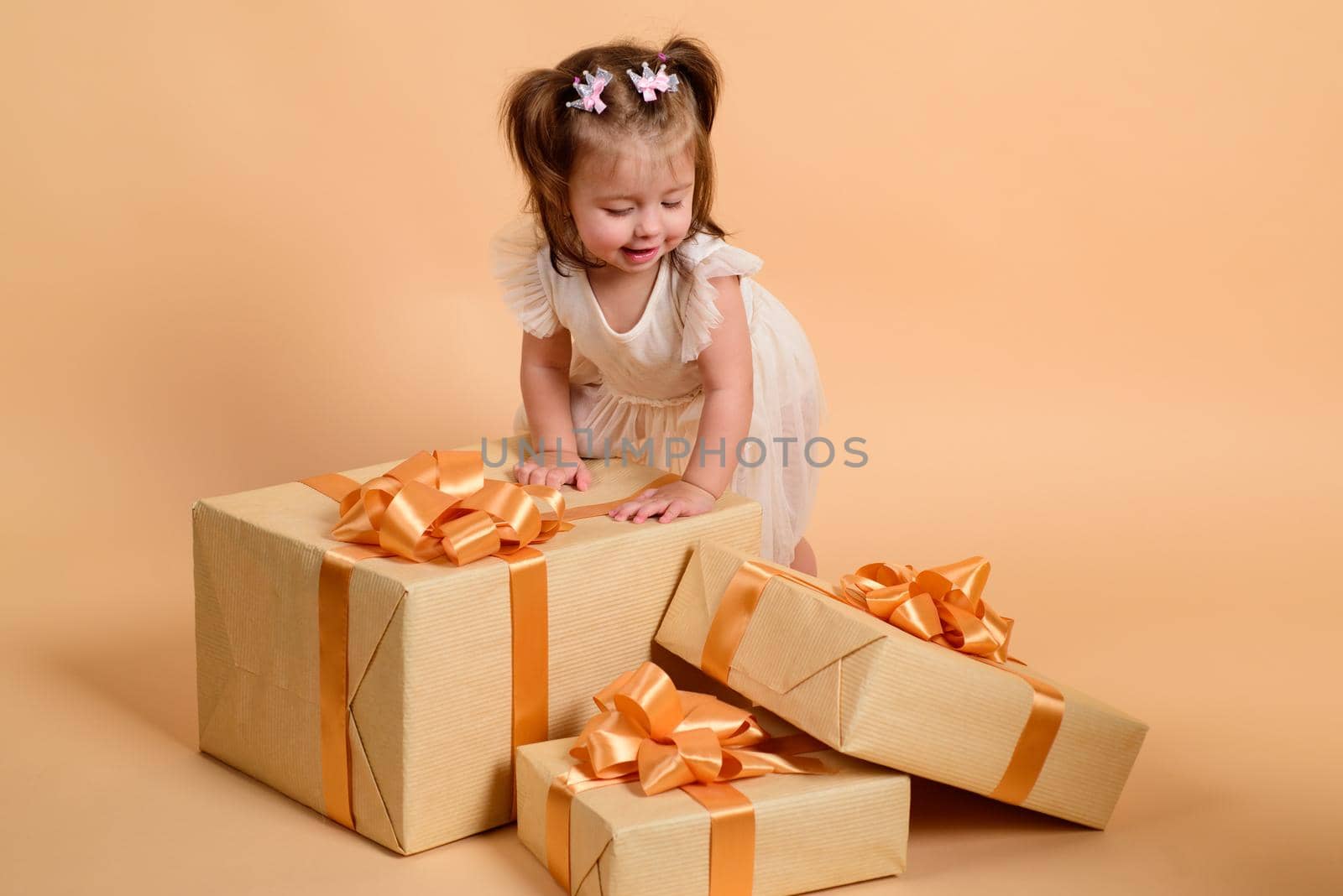Baby with a presents. Birthday gift concept. by Tverdokhlib