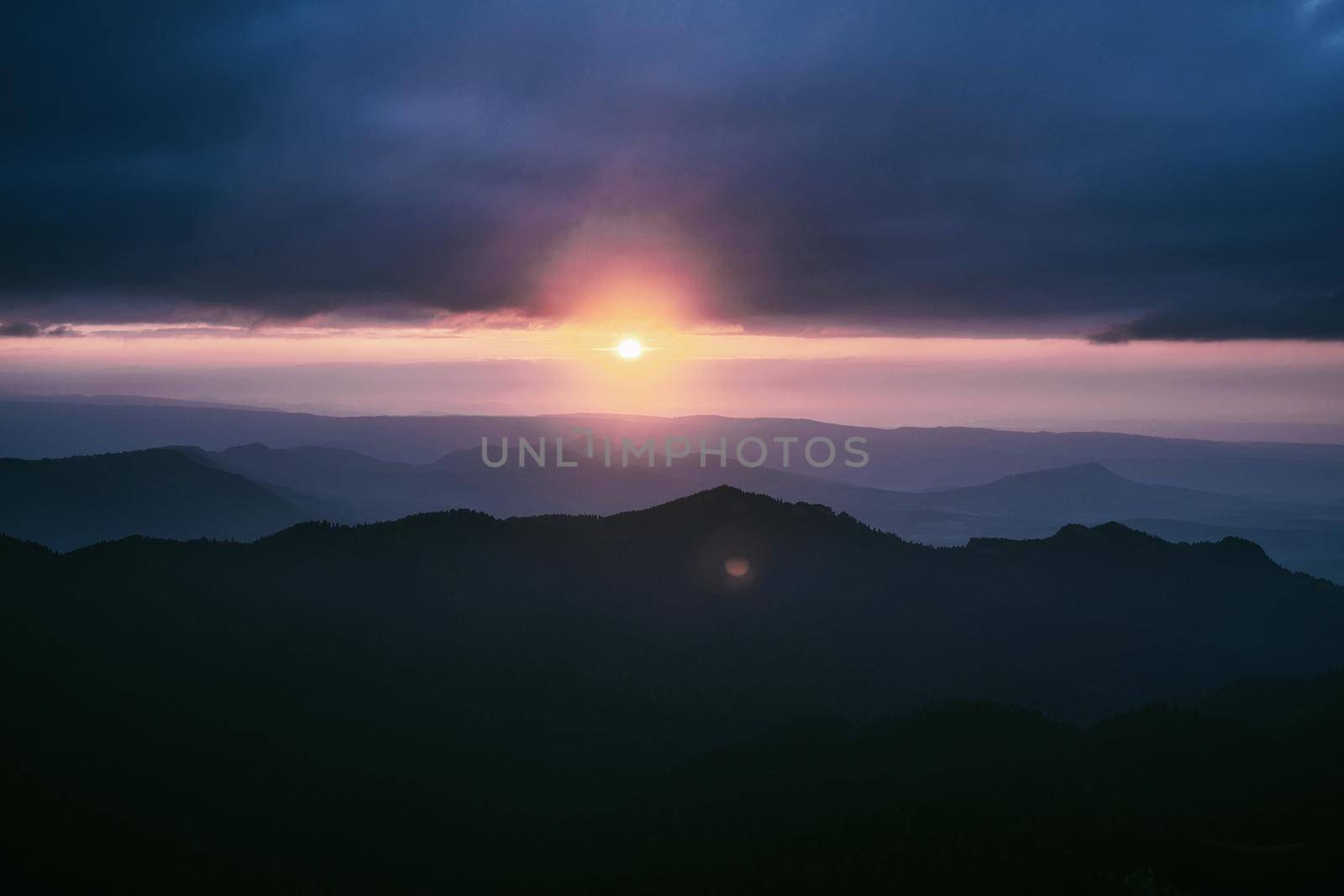 Sunset in the blue ridge mountains with fog.