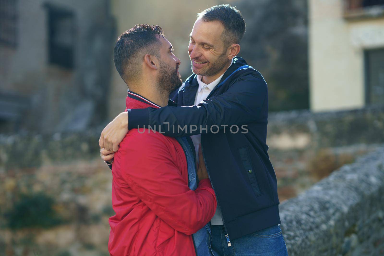 Gay couple making a selfie with their smartphone. LGTB relationship concept.