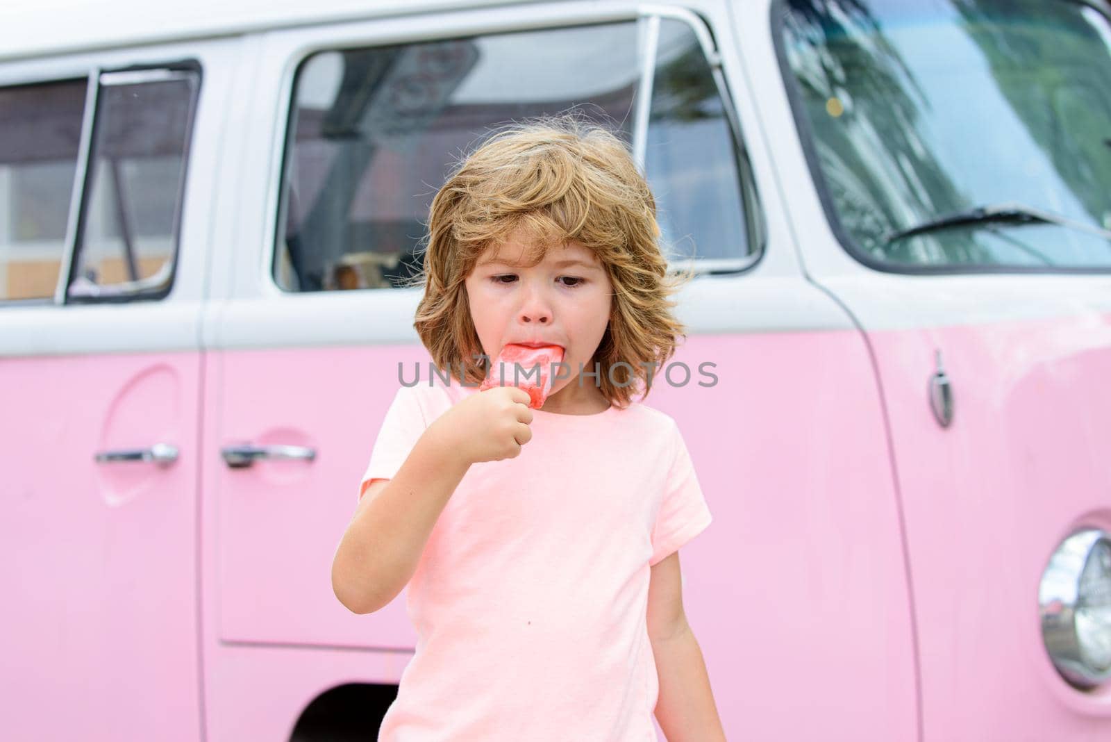 Kids ice cream outdoor. Sweet summer day. by Tverdokhlib