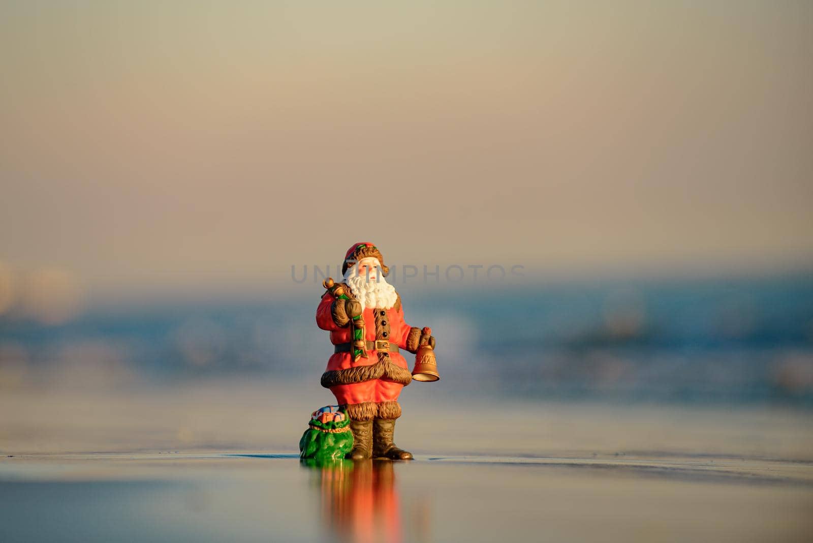 Summer Santa Claus. Christmas and New Year on sea vacation. Santa copy space. Holiday greeting card. by Tverdokhlib