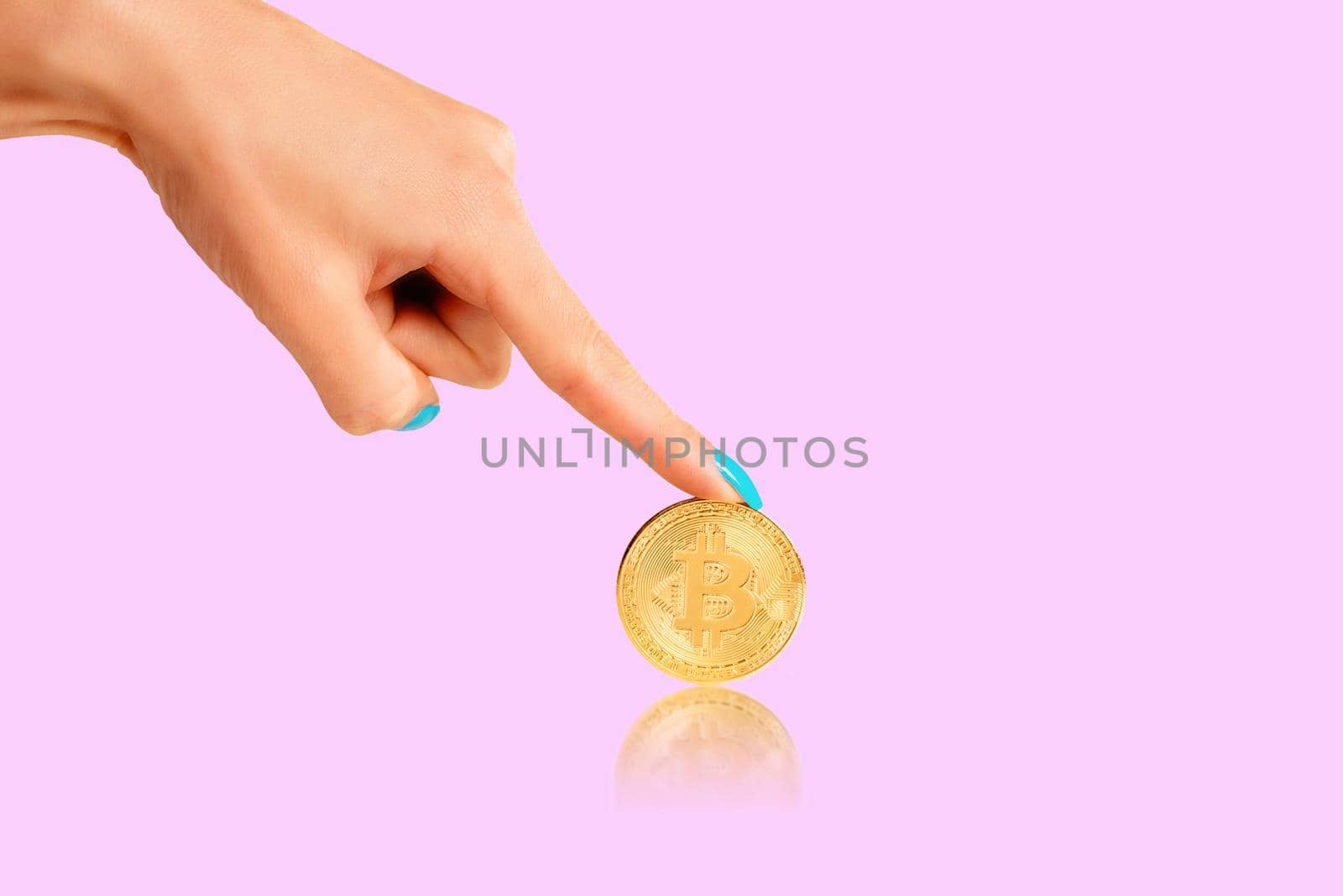 Female hand pointing to cryptocurrency bitcoin. by alexAleksei