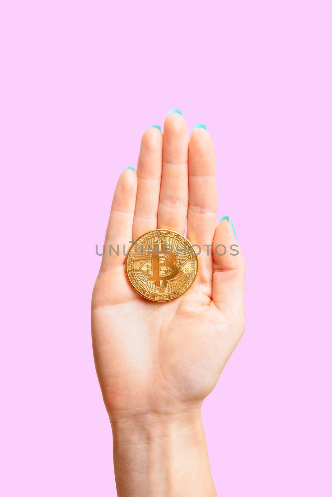 One coin bitcoin on female palm hand. by alexAleksei