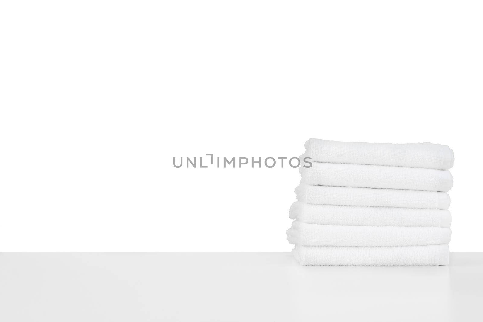 Set of soft spa towels isolated on white by Fabrikasimf
