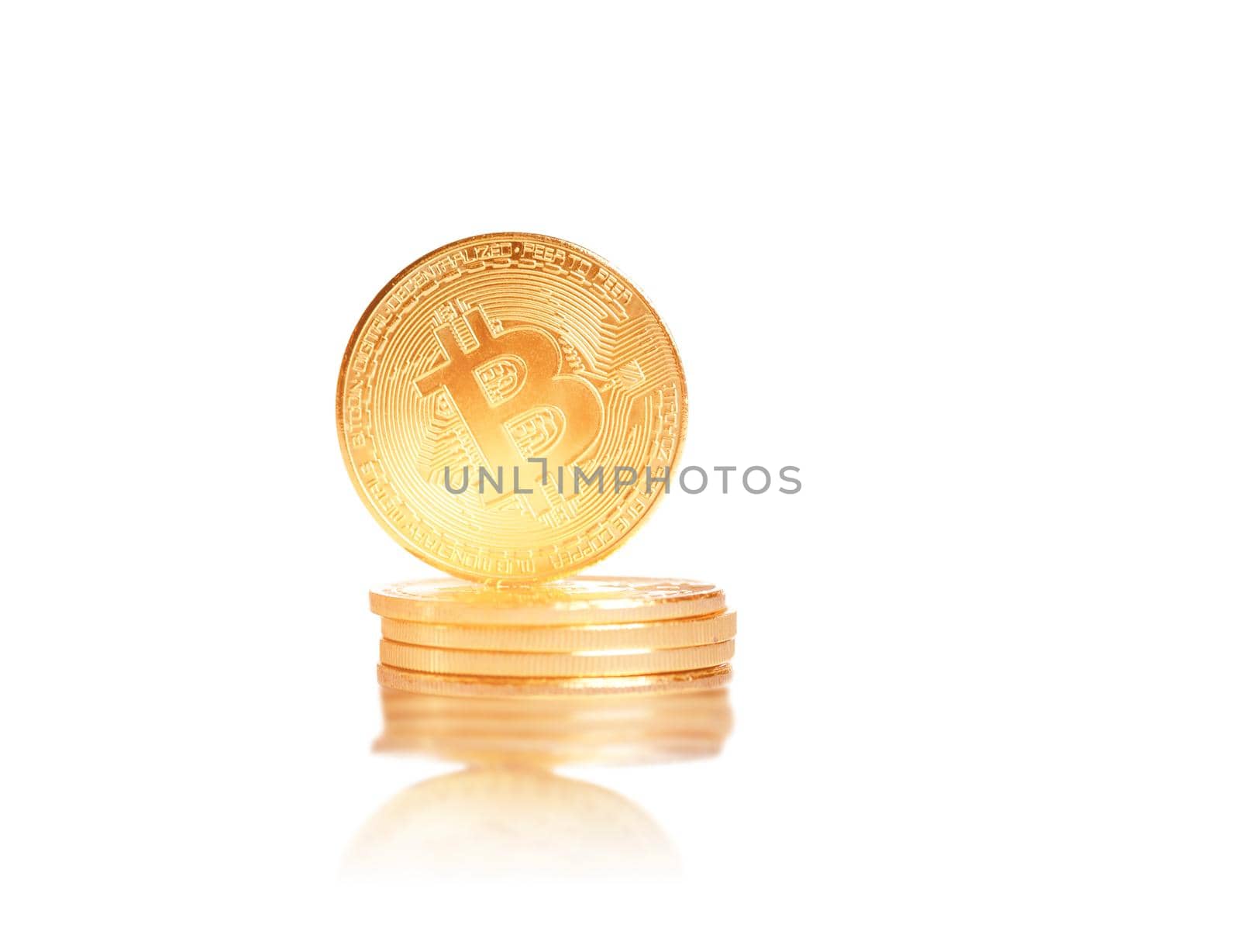 Stack of glowing gold bitcoins. by alexAleksei