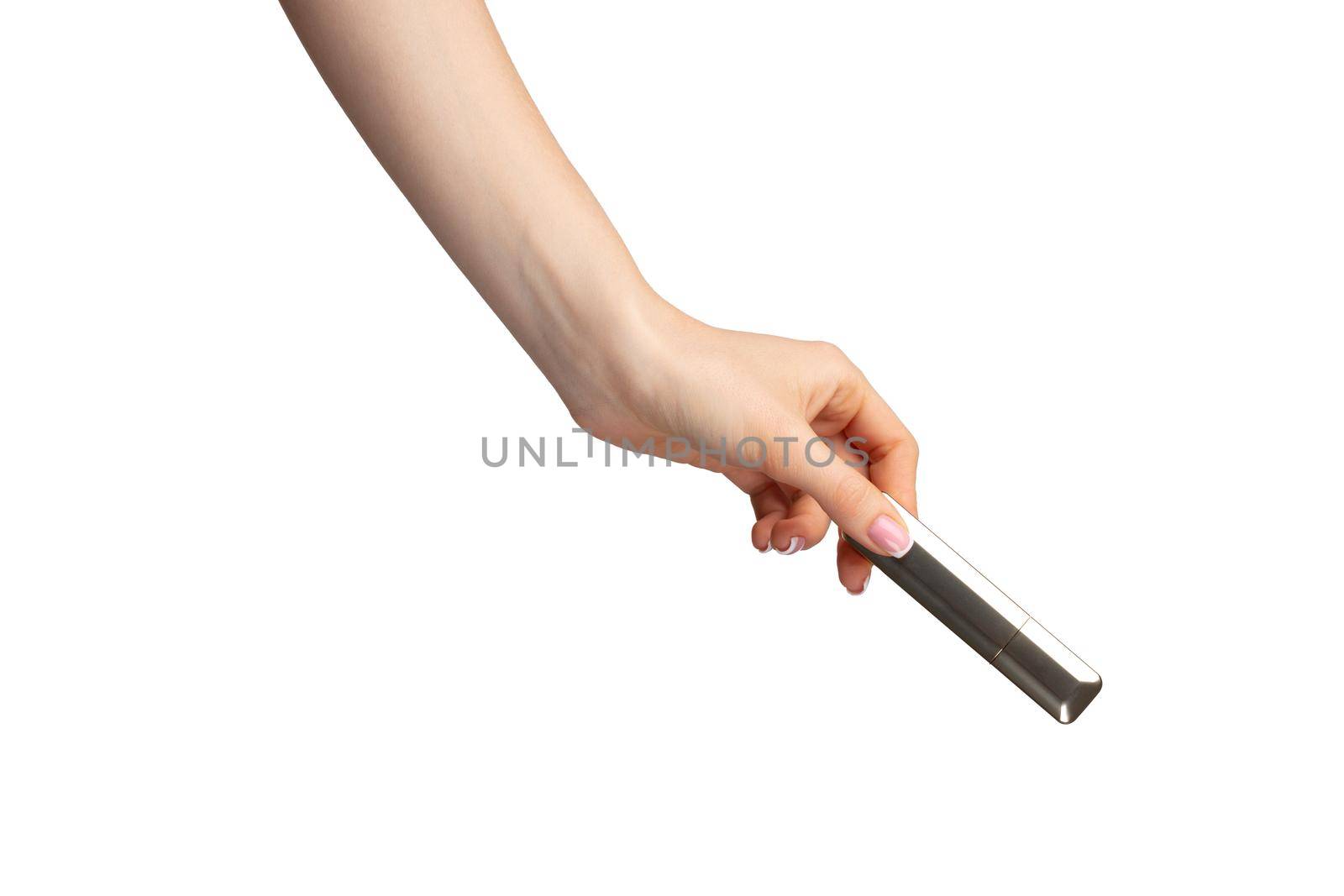Hand holding lipsticks isolated on white background, close up.