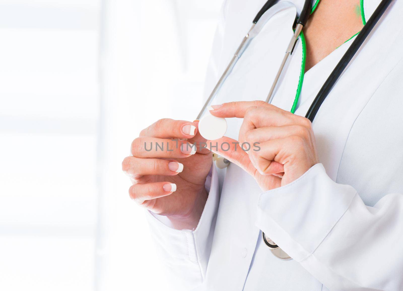 Female doctor with white tablet