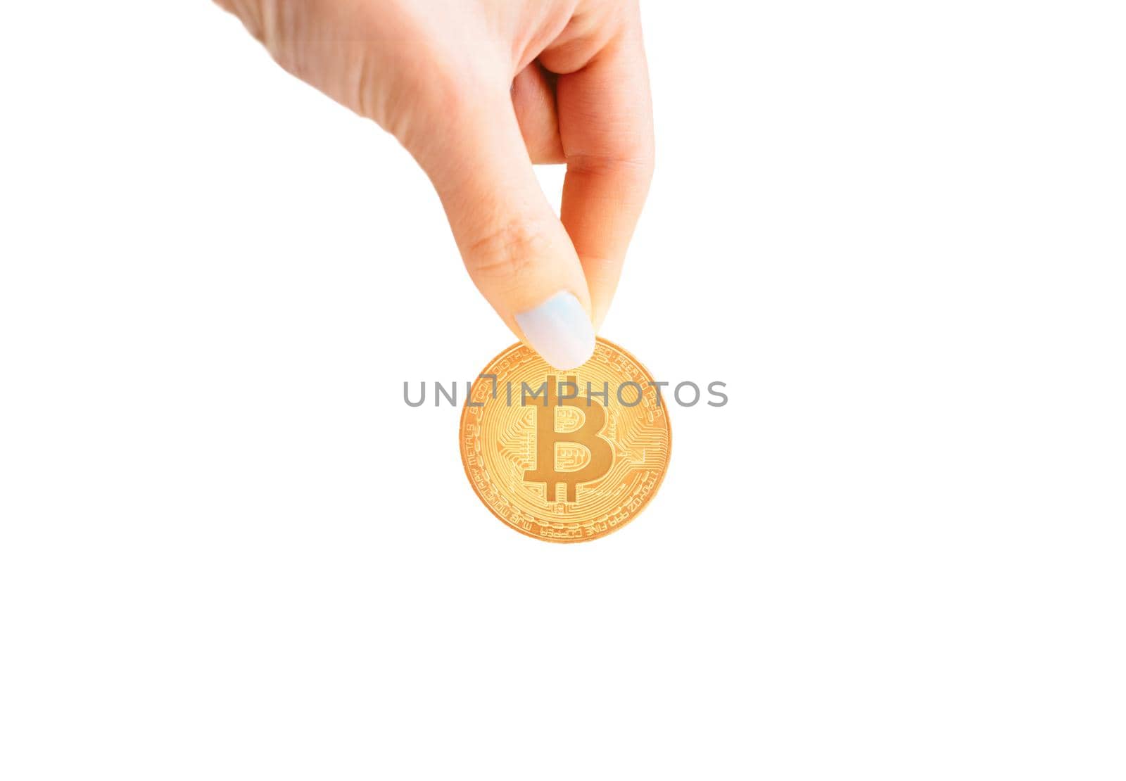 Woman’s hand with glowing gold bitcoin. by alexAleksei