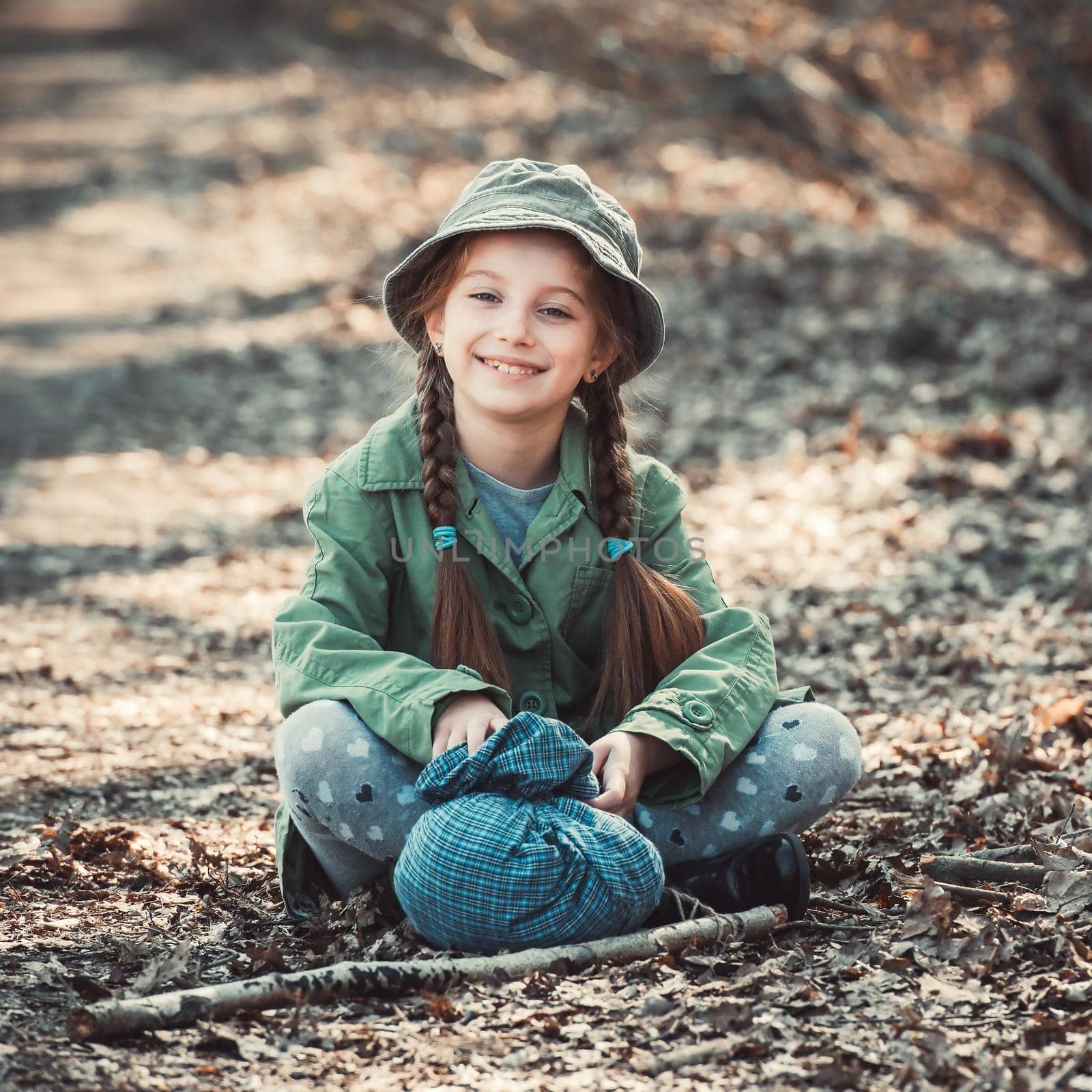 little girl playing in the woods, photo in vintage style
