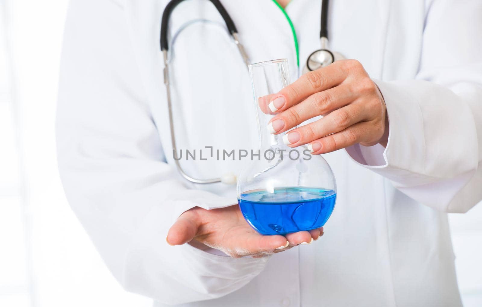 Doctor's hands with flask