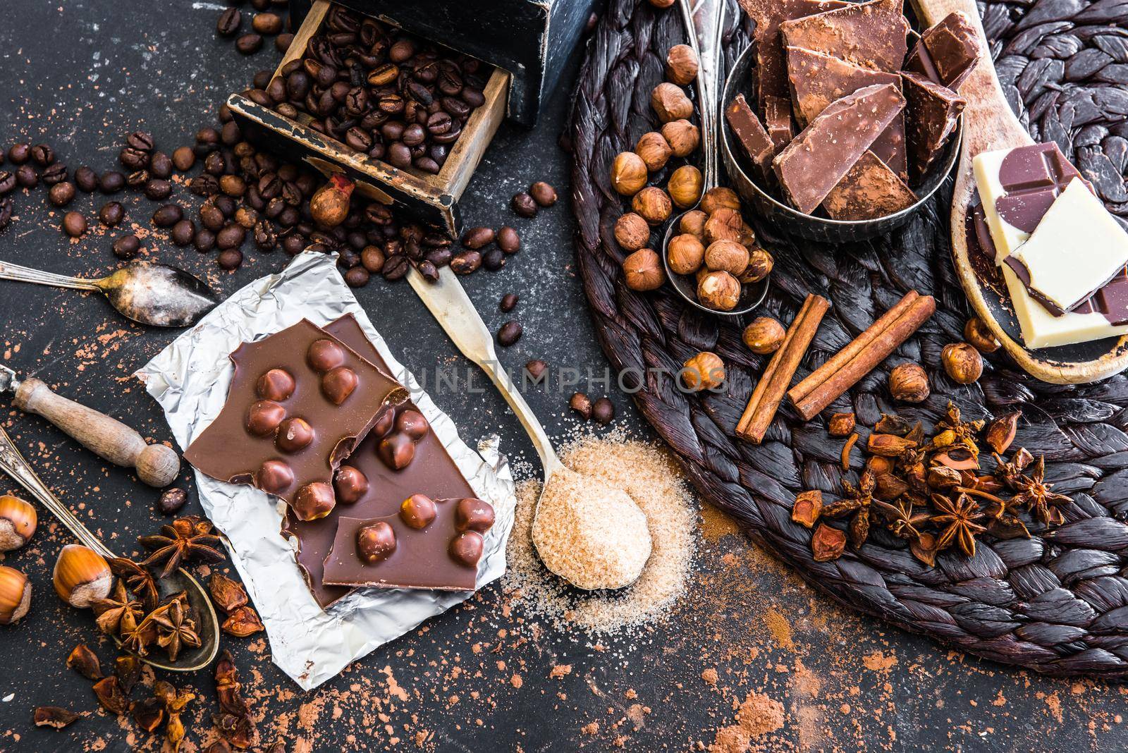 chocolate, cocoa and various spices on table by GekaSkr