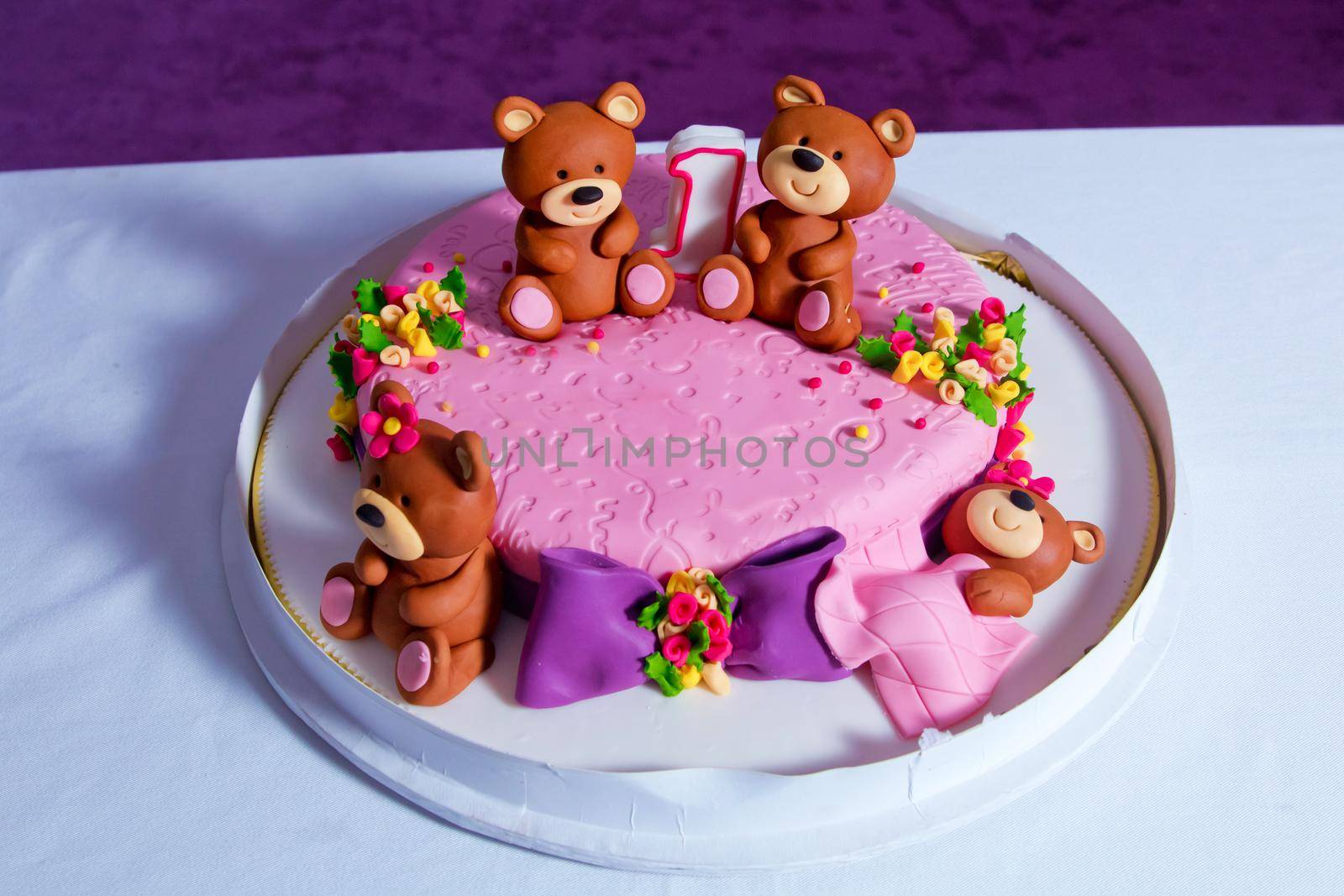 Pink bear bears cake. 1 year old birthday. Cake . Big beautiful kids cake decorated with turquoise Teddy bear by Adil_Celebiyev_Stok_Photo