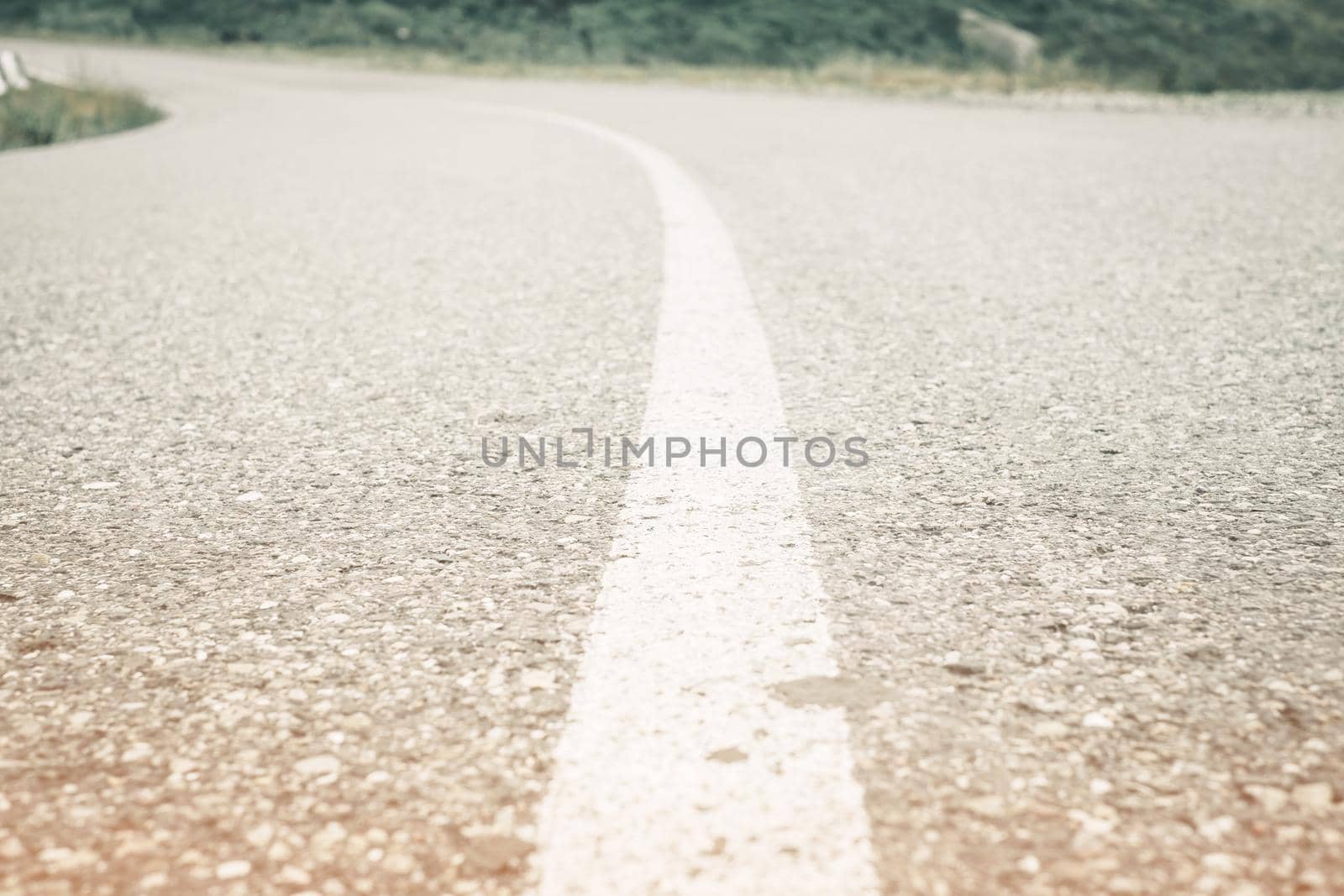 Asphalt road with white solid line. by alexAleksei