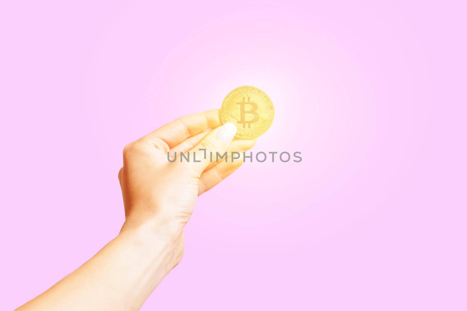 Hand with symbol of cryptocurrency – bitcoin. by alexAleksei