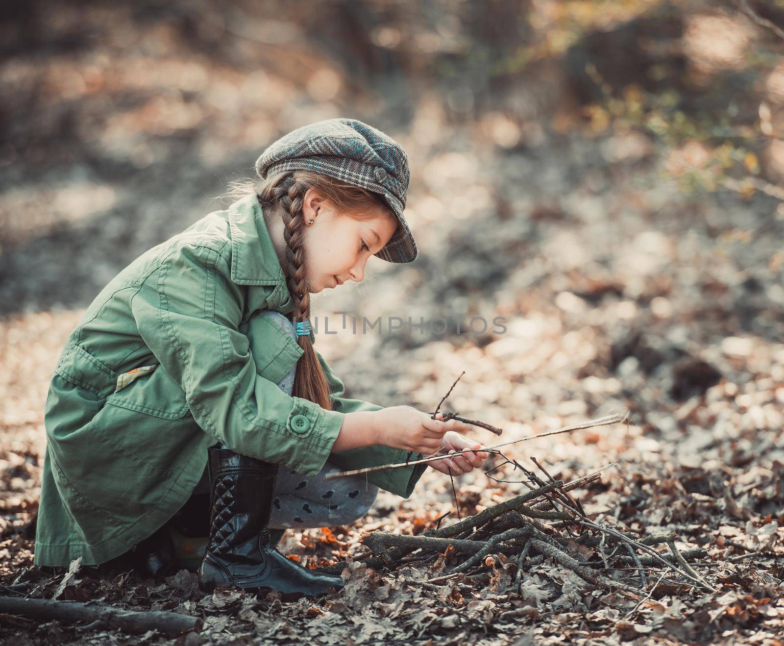 little girl making a bonfire by GekaSkr