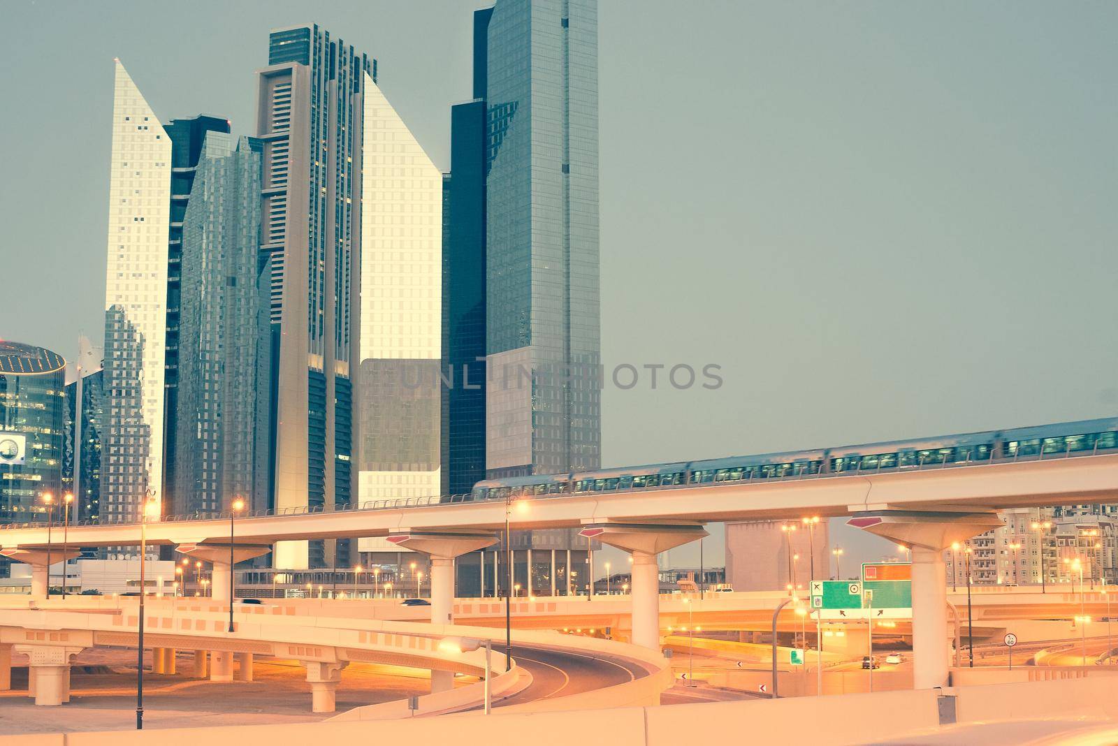 Skyscraper roads and bridge at the Sheikh Zayed Road in Dubai in the evening, United Arab Emirates