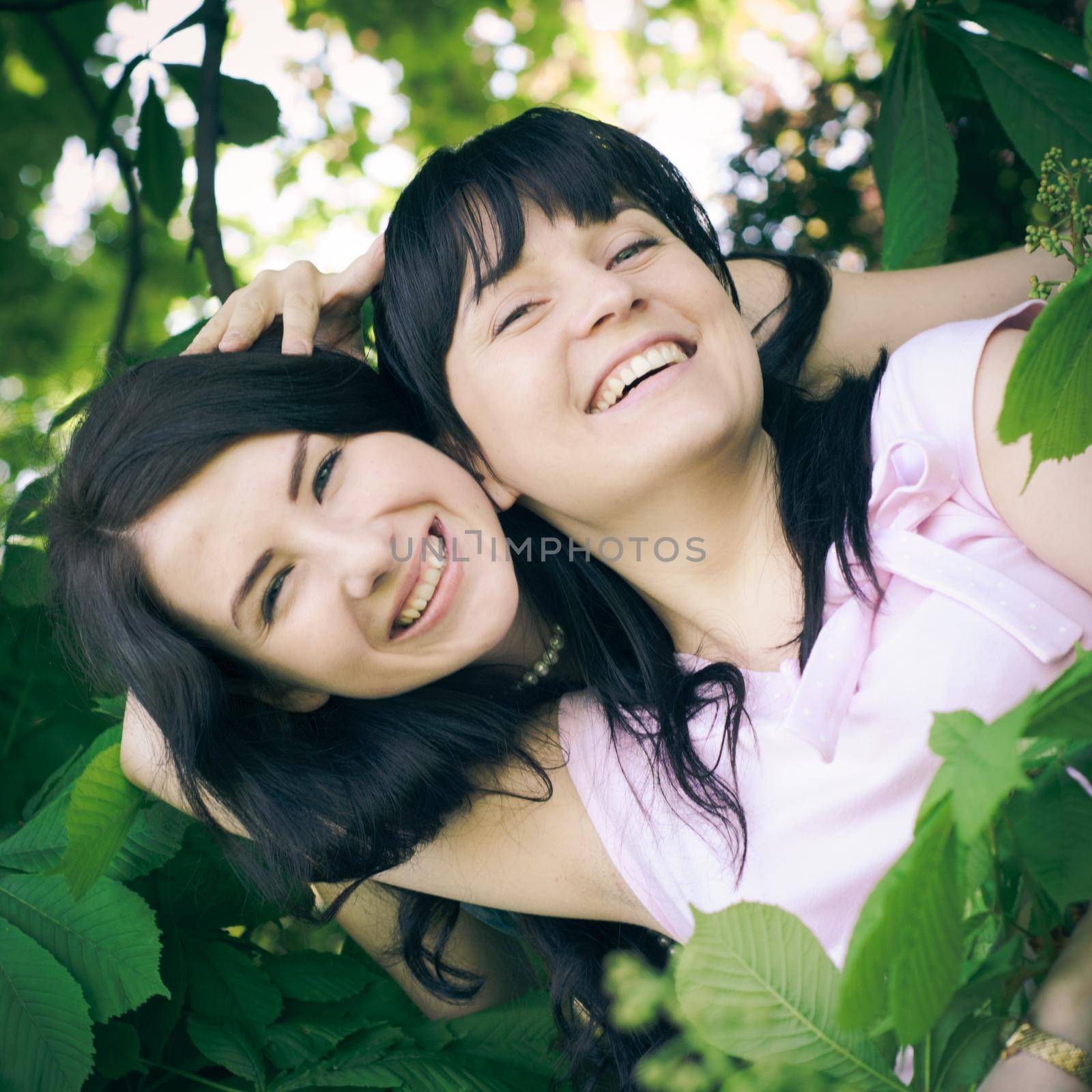 Two sisters fun outdoor. Instagram toned selfie