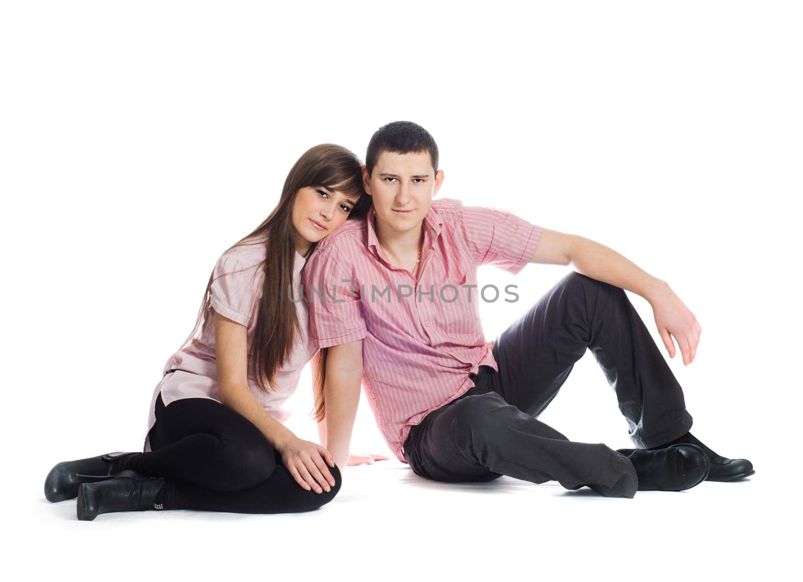 Couple dressed in pink clothes isolated on white