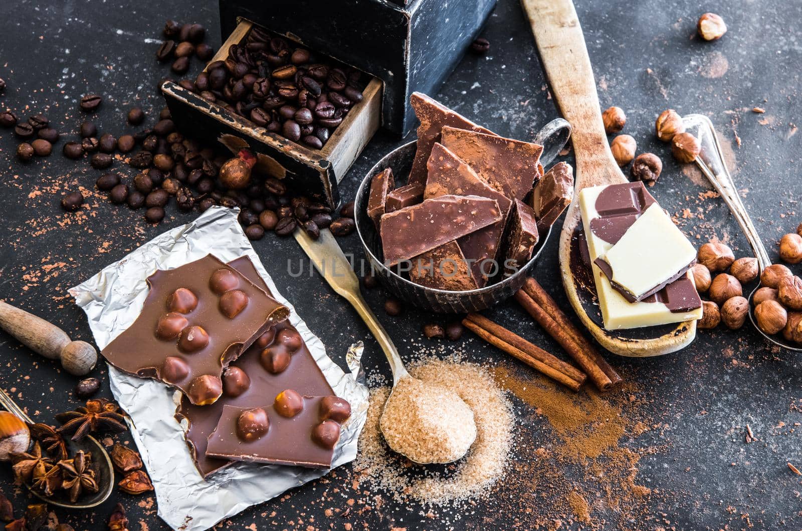 chocolate, cocoa and various spices on table by GekaSkr