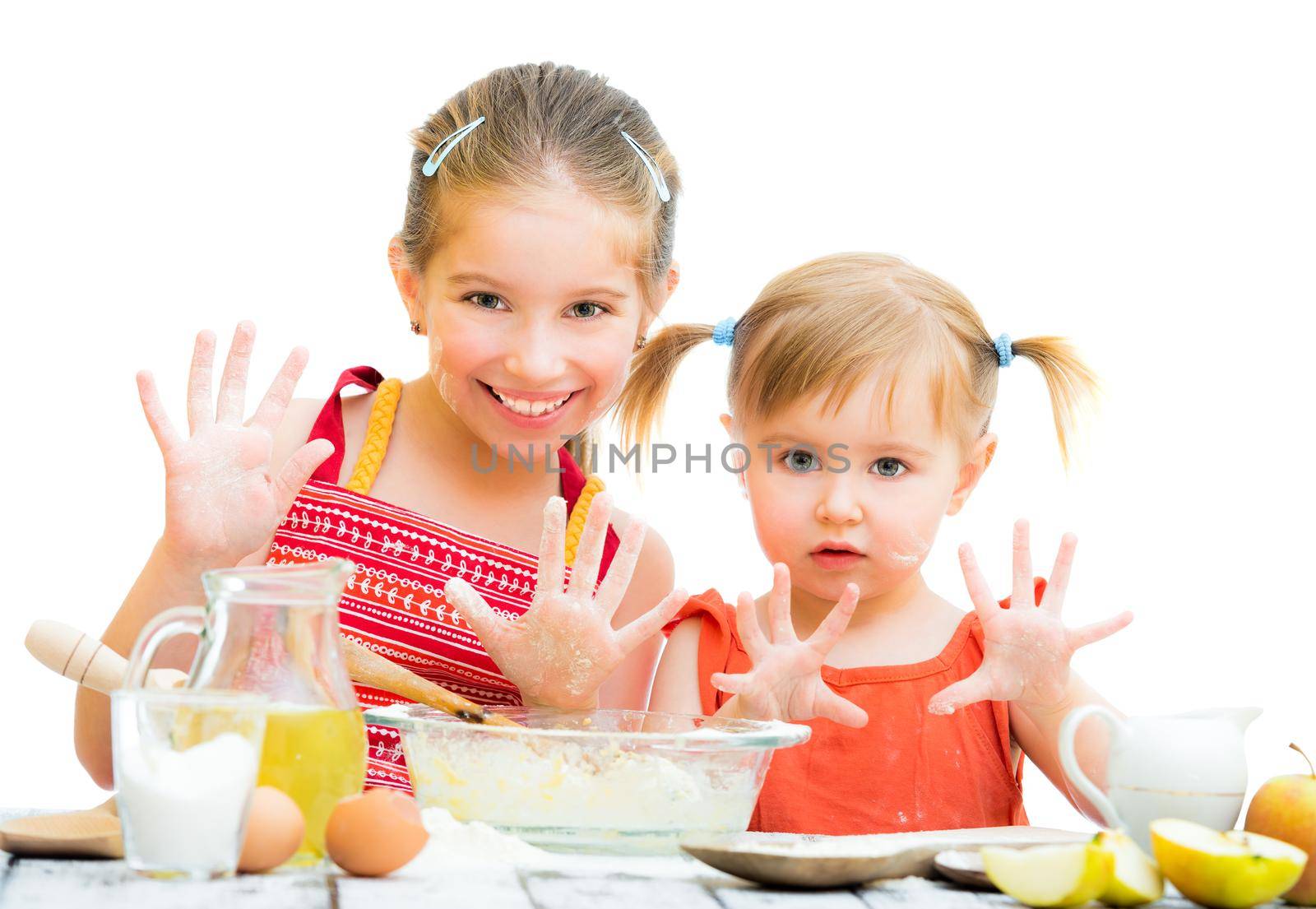 cute little sisters baking on kitchen by GekaSkr