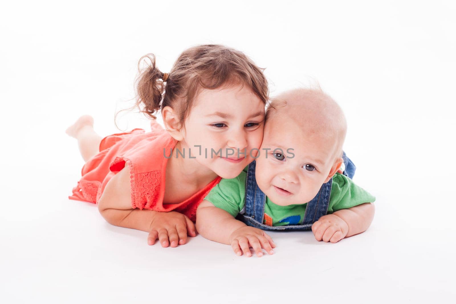 Adorable family. Sister and brother isolated on white