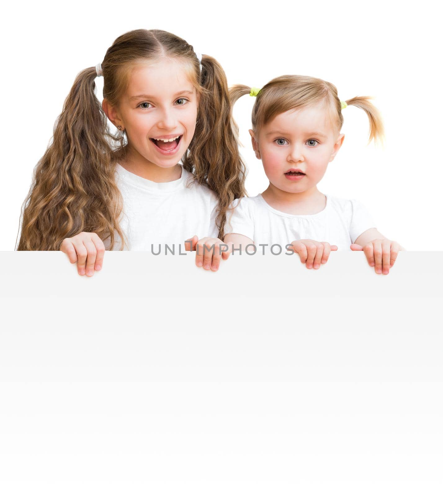 Beautiful sisters with board isolated on a white background