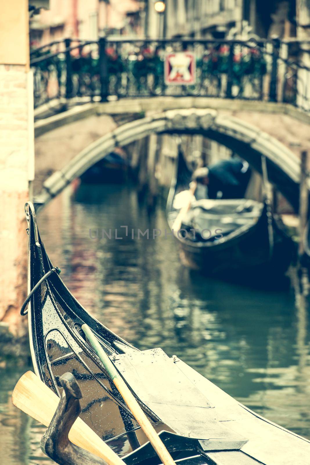 stern of gondola floating on the Venice channel, Italy