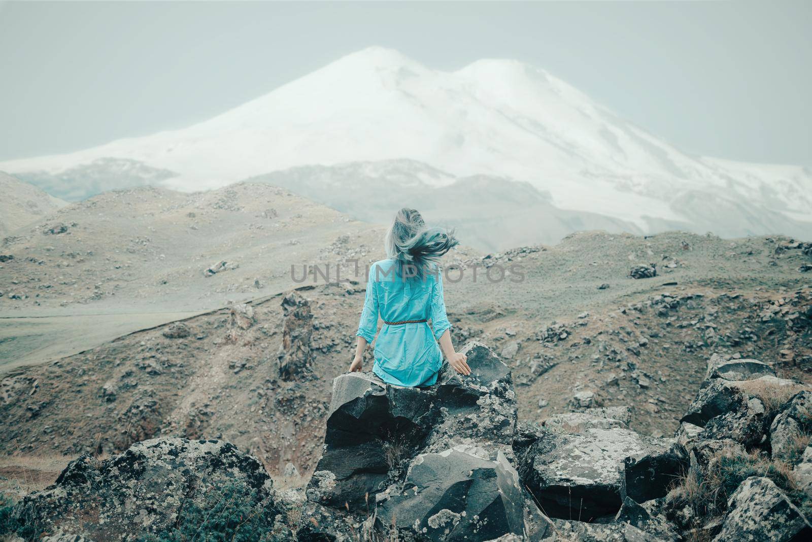 Woman enjoying view of mount Elbrus. by alexAleksei