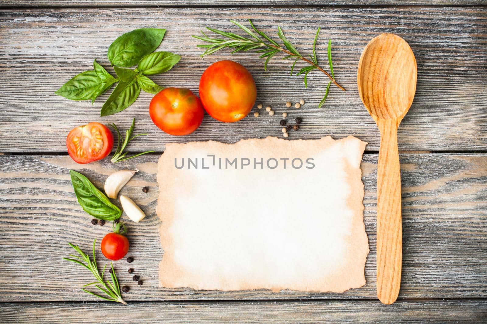 Blank old aged paper with copy space for recipe with ingredients and wooden spoon on the table