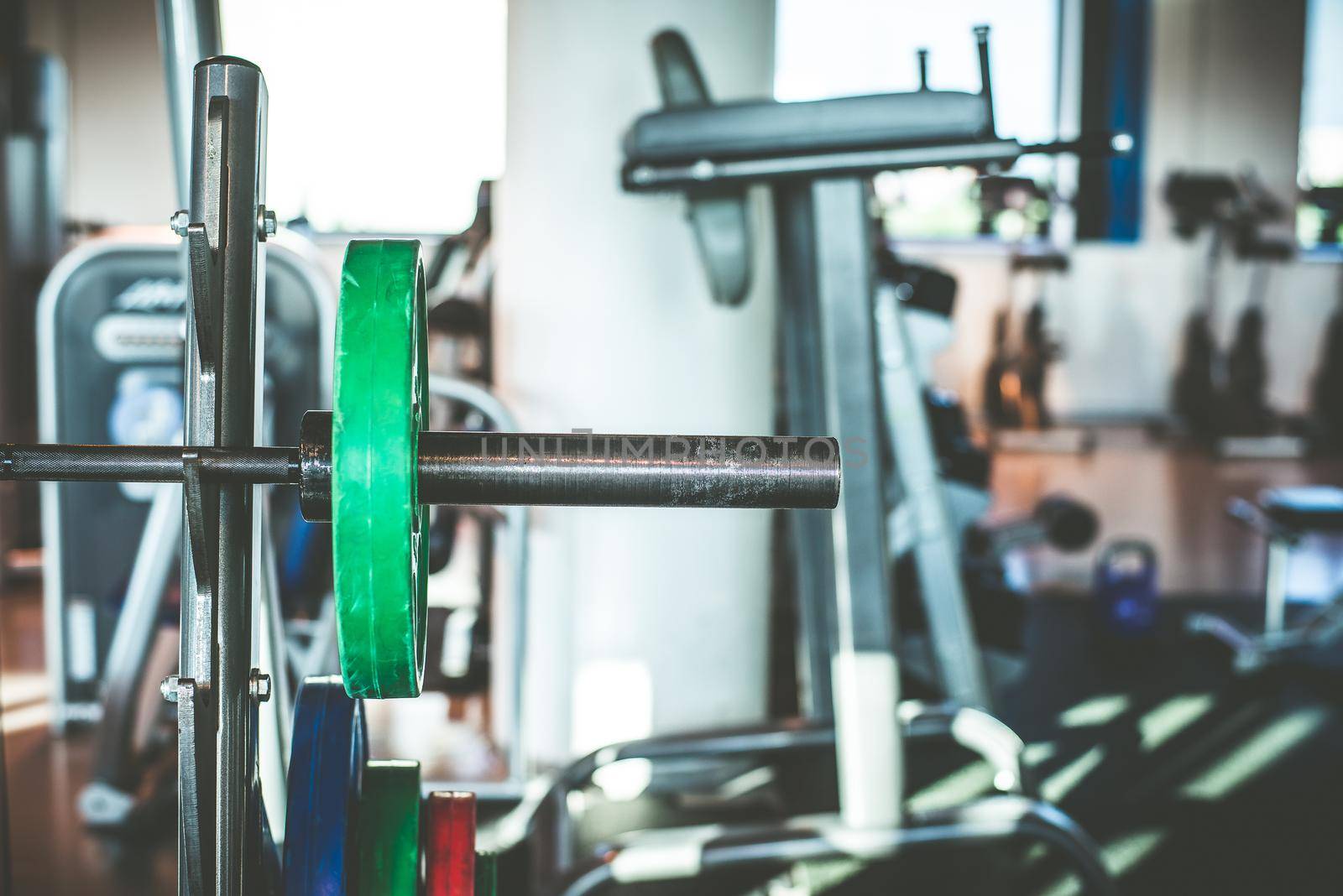 Rod with weights in the gym