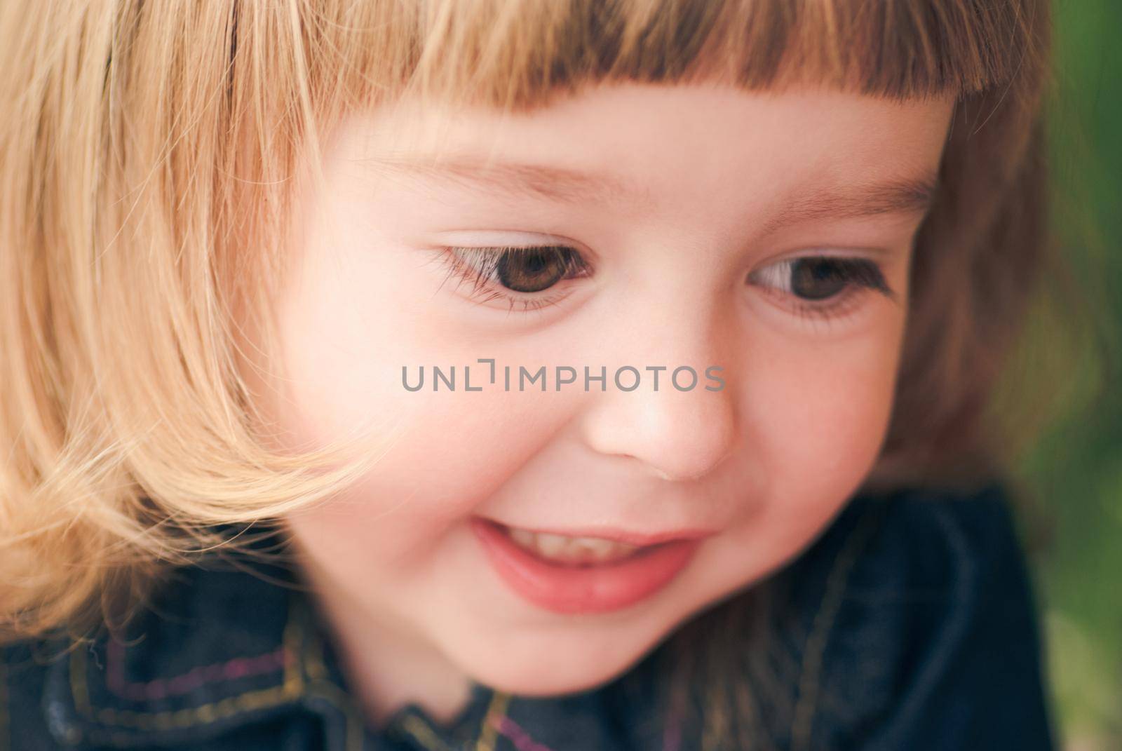 Close up soft portrait of litle girl outdoor