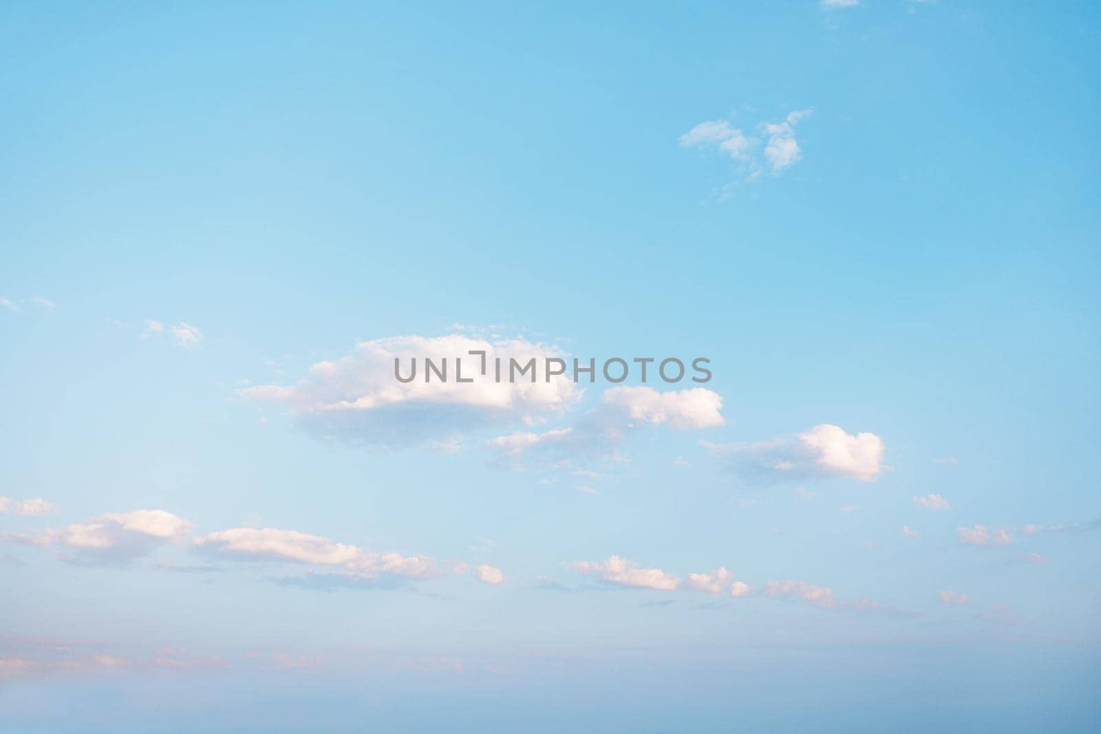 Nature background. Blue sky with cumulus clouds.